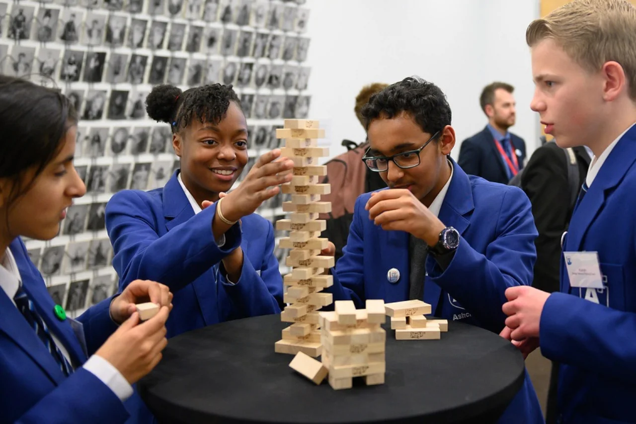 Students building a Jenga Tower at Design Ventura