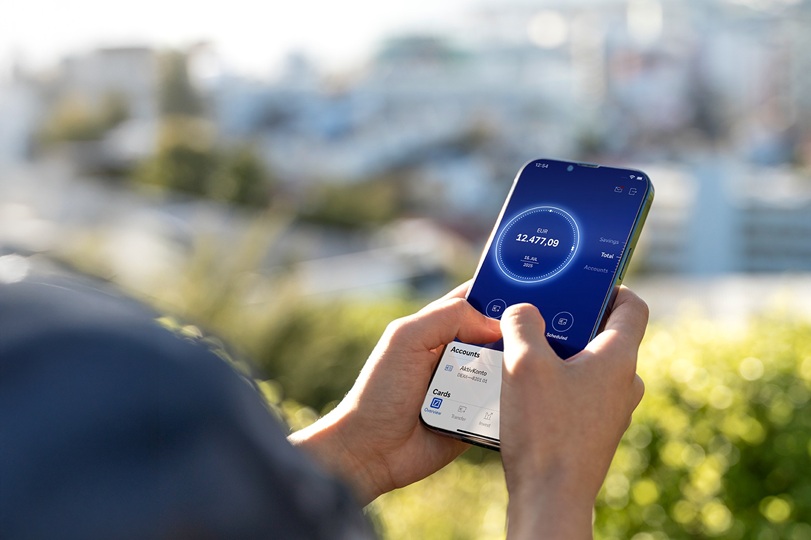 A person checks their bank balance on a mobile banking app. Photo &copy; Getty Images and Deutsche Bank.